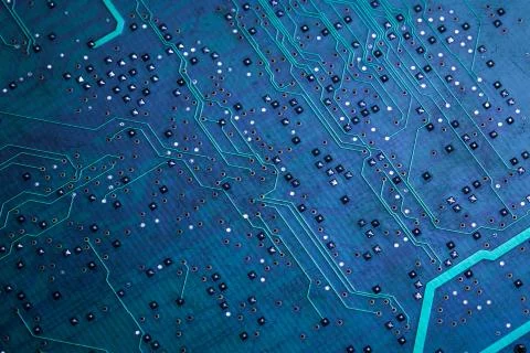 Printed green computer circuit board with many electrical components Stock Photos
