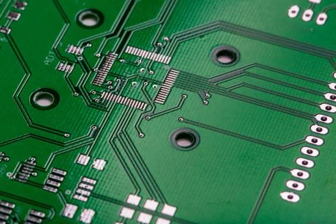 Printed green computer circuit board with many electrical components Stock Photos