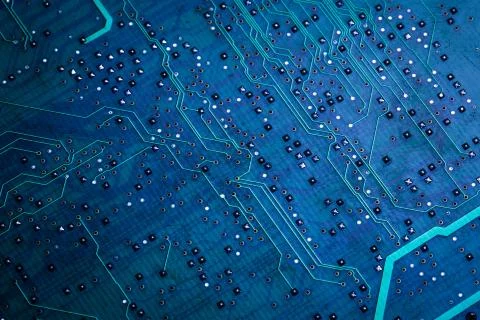 Printed green computer circuit board with many electrical components Stock Photos