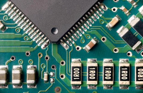 Printed green computer circuit board macrophoto Stock Photos