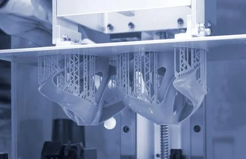 Printed models on 3D printer close-up. Objects printed on photopolymer sla Stock Photos