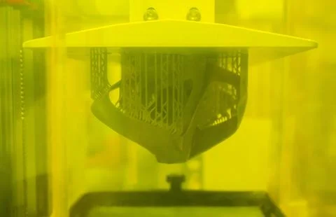 Printed models on 3D printer close-up. Objects printed on photopolymer sla Stock Photos