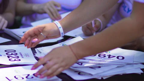 The printed numbers of the participants are on the table Stock Footage 156199080