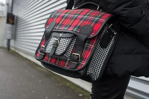 Printed scottish pattern hand bag on woman standing in the street Stock Photos