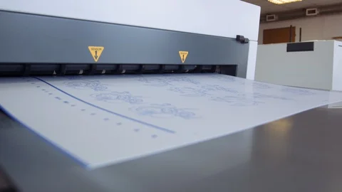 Printed sheet of paper coming out from printing machine. Offset printing, CMYK Stock Footage 110793650