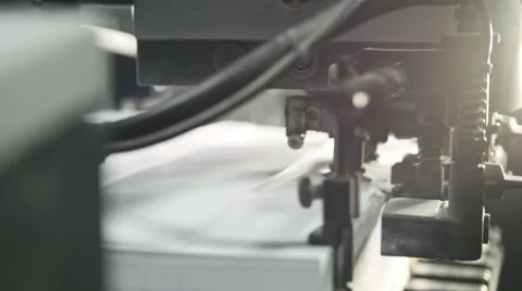 Printed sheets of paper are served in the printing press. Offset printing, CMYK Stock Footage 67732095