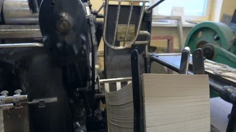 Printed sheets of paper are served in the printing press Stock-Footage 120896509