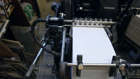 Printed sheets of paper are served in the printing press Stock-Footage 120896704