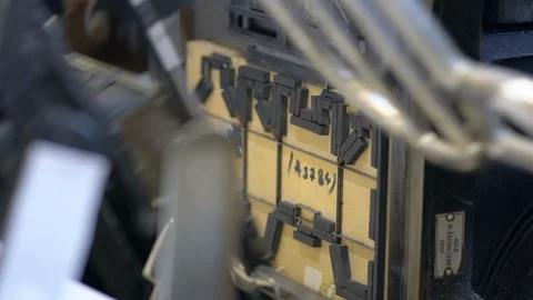 Printed sheets of paper are served in the printing press Stock-Footage 120897272
