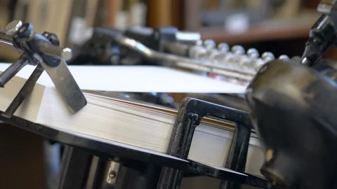 Printed sheets of paper are served in the printing press Stock-Footage 120897533