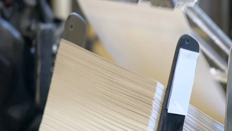 Printed sheets of paper are served in the printing press Stock-Footage 120897603