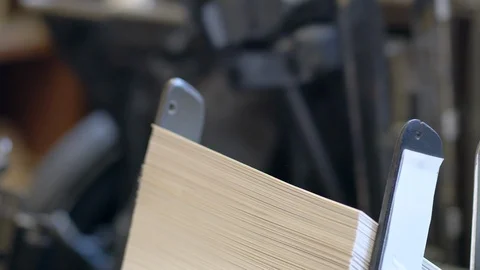 Printed sheets of paper are served in the printing press Stock-Footage 120897694