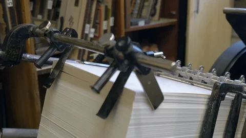 Printed sheets of paper are served in the printing press Stock-Footage 120898071