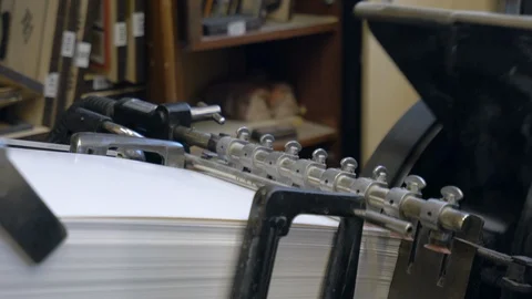 Printed sheets of paper are served in the printing press Stock-Footage 120898131