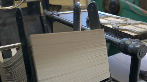 Printed sheets of paper are served in the printing press Stock-Footage 120898202