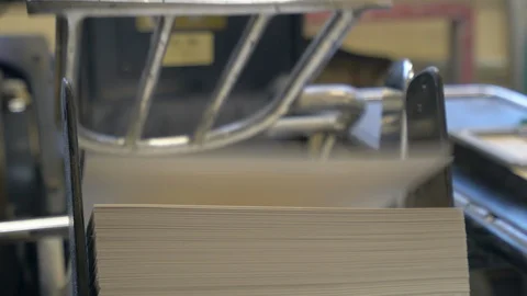 Printed sheets of paper are served in the printing press Stock Footage 120898302