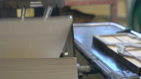 Printed sheets of paper are served in the printing press Stock Footage 120898659