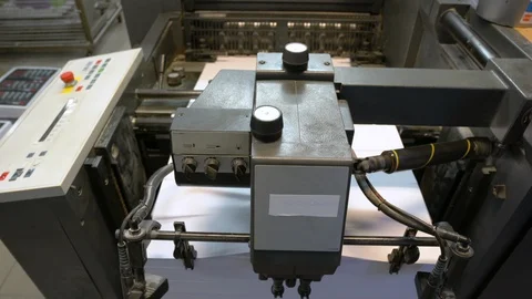 Printed sheets of paper are served in the printing press Stock Footage 120902024