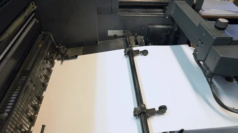 Printed sheets of paper are served in the printing press Stock Footage 120902335