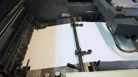 Printed sheets of paper are served in the printing press Stock Footage 120902361