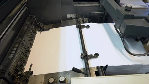 Printed sheets of paper are served in the printing press Stock Footage 120902424