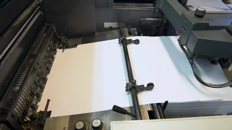 Printed sheets of paper are served in the printing press Stock Footage 120902672