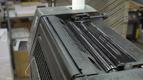 Printed sheets of paper are served in the printing press Stock Footage 120902731