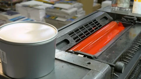 Printed sheets of paper are served in the printing press Stock Footage 120903200