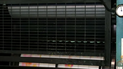 Printed sheets of paper rolled in printing press Stock Footage 65318037