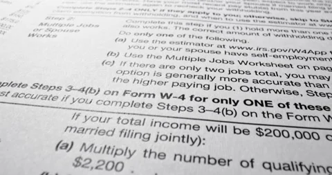 Printed withholding forms in real camera shot Stock Footage 345251224