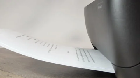 Printer In Action. Paper sheet being printed. Detail shot of black printer Stock Footage 189982503