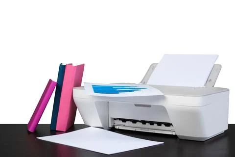 Printer and stack of books on black table against white background Stock Photos