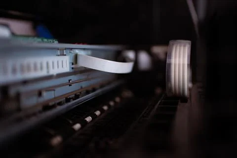 The printer is being repaired. It involves disassembling the machine. Stock Photos