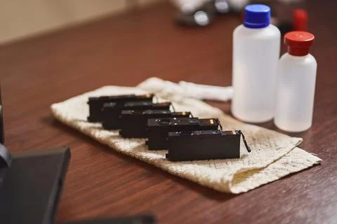 Printer cartridges in the process of being cleaned Stock Photos