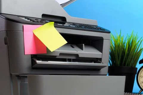 Printer, copier, scanner on color background . Office table Stock Photos