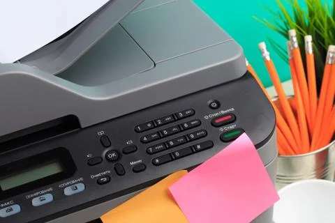 Printer, copier, scanner on color background . Office table Stock Photos