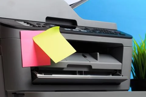 Printer, copier, scanner on color background . Office table Stock Photos