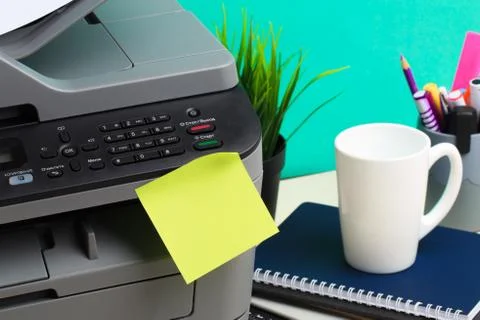 Printer, copier, scanner on color background . Office table Stock Photos