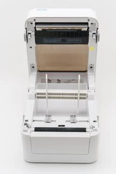 Printer device showing open compartment for paper loading Stock Photos