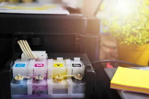 The printer is fully functional,Located on the desk. Ink tank that looks smea 写真素材