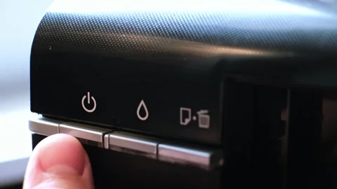 The printer has a green indicator light and an orange warning light indicating a 動画素材 313375106