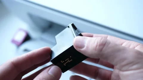 Printer Ink Cartridge In Hands Closeup Видео 154429318