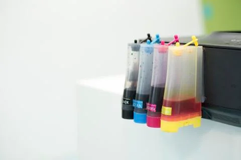 Printer Ink jet tank. Computer and Color concept. Technology accessories and  Stock Photos