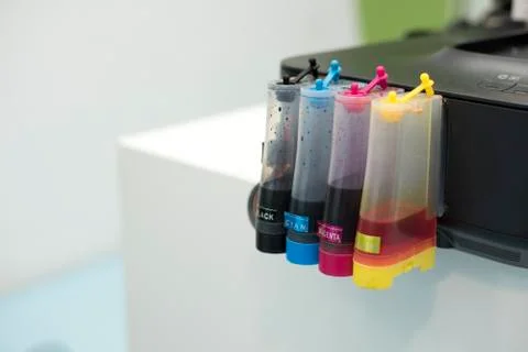 Printer Ink jet tank. Computer and Color concept. Technology accessories and  Fotos Stock