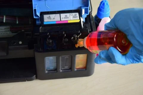 Printer ink Refilling ink for refillable printers. Stock Photos