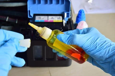 Printer ink Refilling ink for refillable printers. Stock Photos