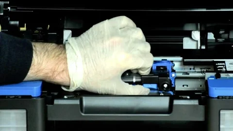 Printer Ink System Repair- Gloved Technician Adjusts Blue Cartridge 스톡 동영상 320385014