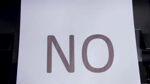The printer print the word NO on a white sheet. Top view. Close up Stock Footage 149528129