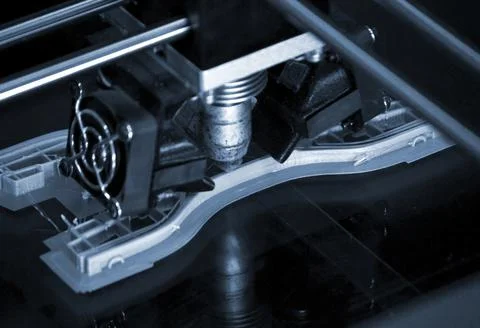 Printer printing gray objects on mirror reflective surface close-up top view Foto stock