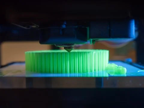 Printer printing a green 3d object Stock Photos